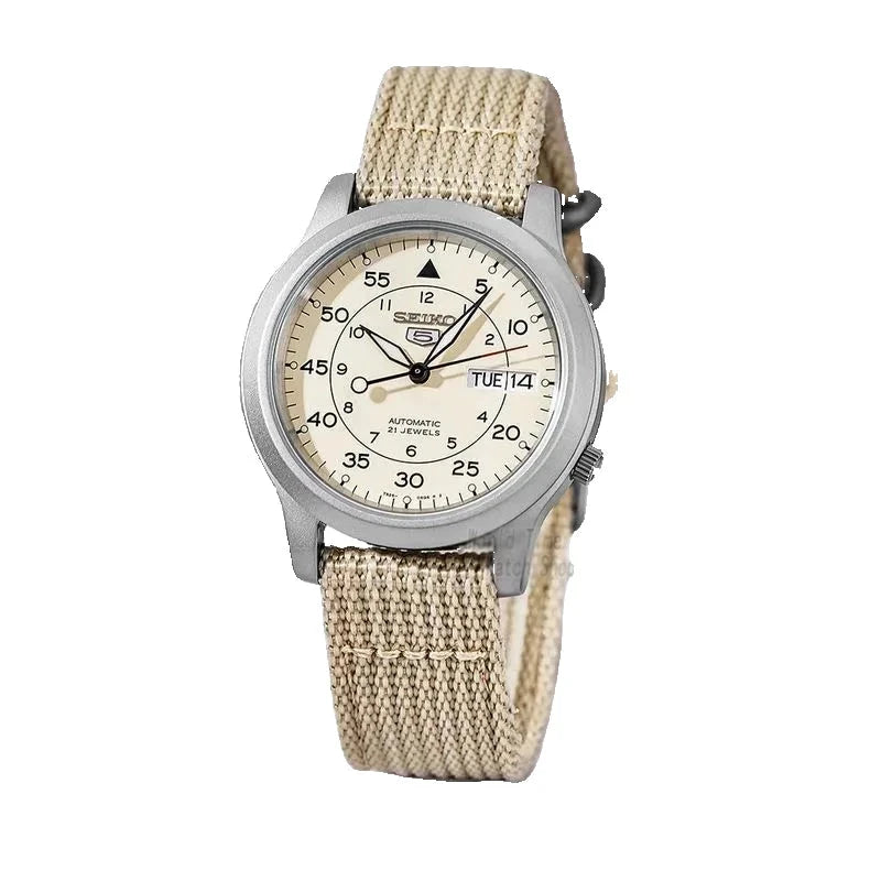 Seiko watch with beige strap and cream face on white background