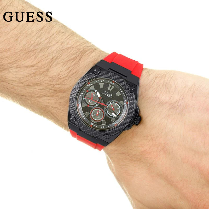 Wristwatch with red strap on wrist
