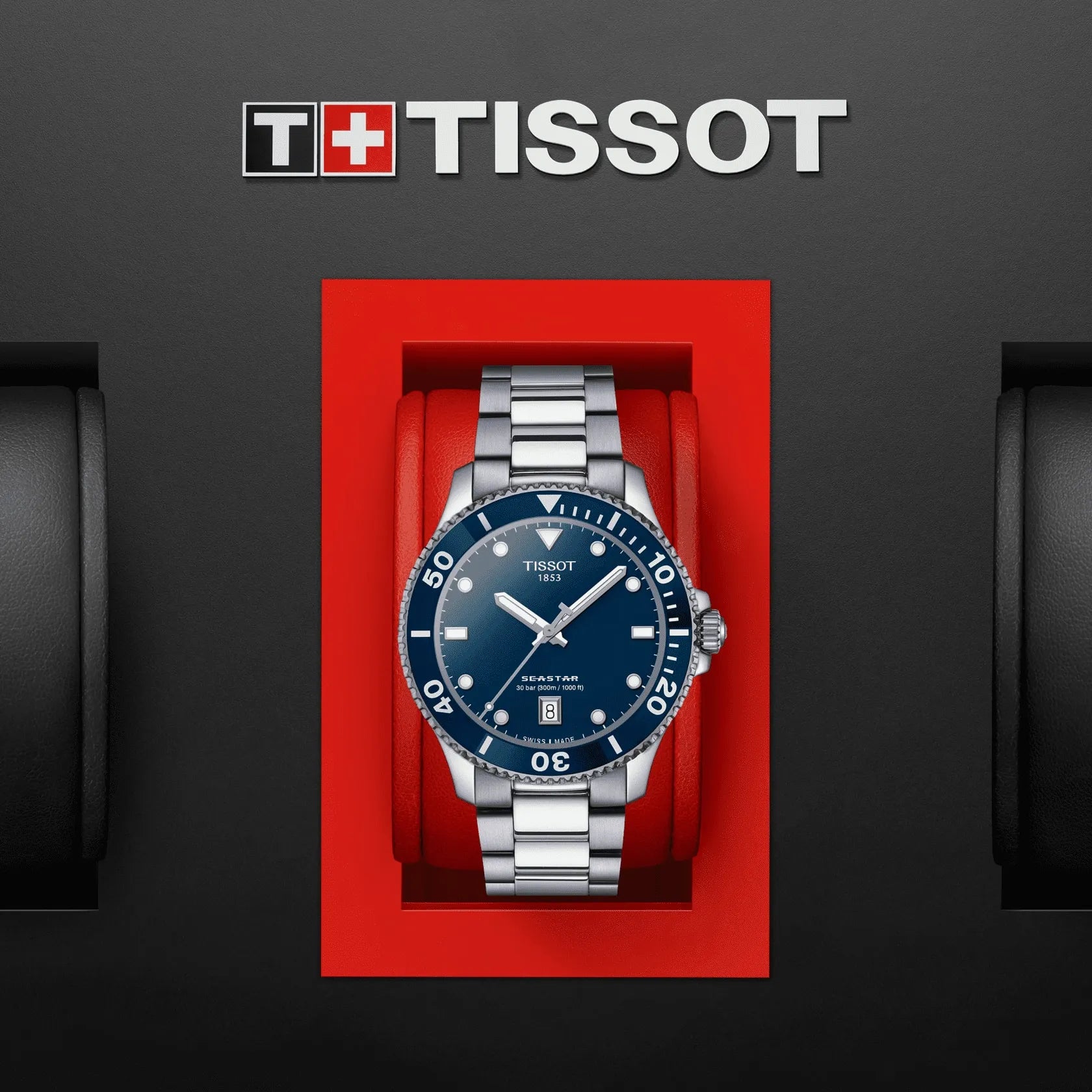 Tissot watch in a red box with Tissot logo above on a dark background