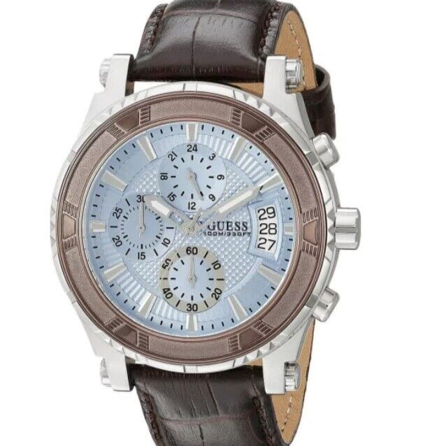 Guess watch with brown leather strap and blue dial on a white background